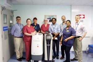 Staff from the Trust’s Urology and Theatres team alongside the first laser machine and new upgraded machine