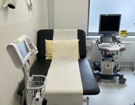 Clinic room with bed and equipment