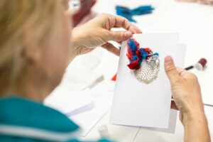 A member of staff creating a card