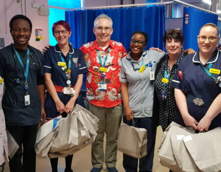 Staff receiving bags with gifts