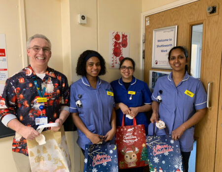 Staff receiving Christmas gifts