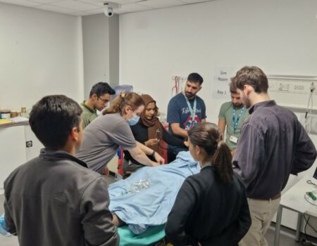 Staff gathered round a demonstration