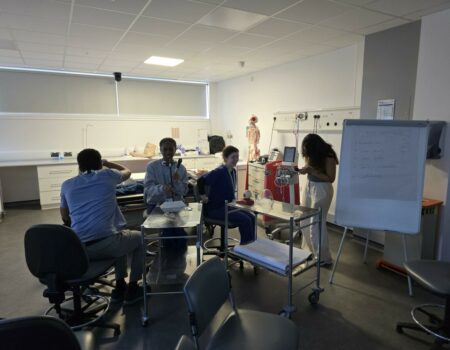 Staff laughing while on a training course