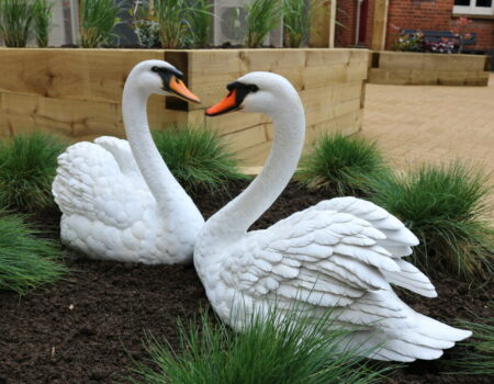 Swan statues in Swannery Garden