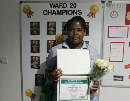 Janet with her DAISY certificate