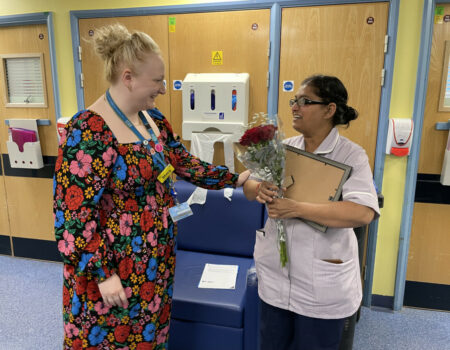 Alps receiving flowers from Stacy