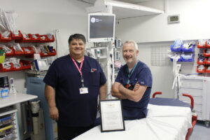 Amir Reyahi and David Kirby with the certificate