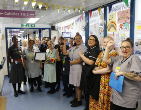 Demi and the paediatrics team cheering