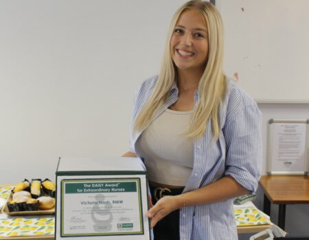 Victoria with her DAISY certificate