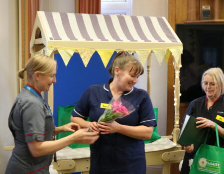 Sarah being given flowers