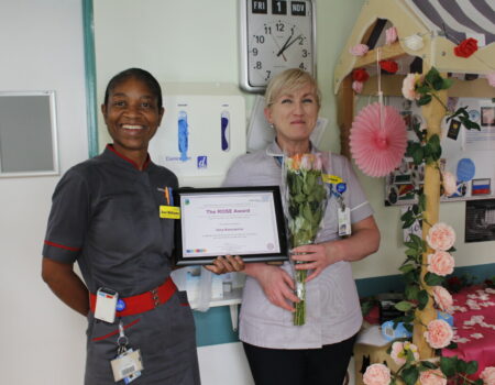 Ann Williams presenting Irina with the ROSE certificate