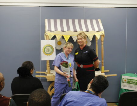 Pamela Mutillio with her certificate and flowers and Liz