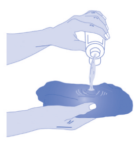 Lotion being poured onto damp disposable cloth