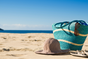 Sunhat and bag on a beach