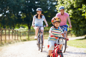 A family cycling outdoors